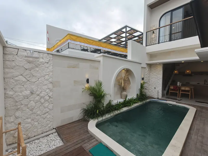 Pool courtyard with limestone wall